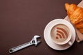Cup of coffee with WiFi sign on the foam. Free access point to the Internet WiFi. I like coffee break with croissant Royalty Free Stock Photo
