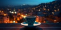 cup of coffee on window topin street cafe at night ,view on rainy city blurred light