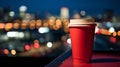 cup of coffee on window topin street cafe at night ,view on rainy city blurred light Royalty Free Stock Photo