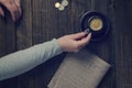 A cup of coffee in a woman`s hand