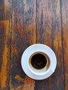 Cup of coffee on the wood table