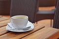 a cup of coffee on a wooden table Royalty Free Stock Photo