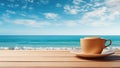 Cup of coffee on wooden table over blue sea and sky background Royalty Free Stock Photo