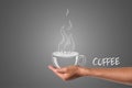 A cup of coffee written in white chalk in his hand, draw concept Royalty Free Stock Photo