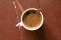 cup with custard coffee on a white background top view, coffee on a wooden table in the morning