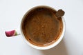 cup with custard coffee on a white background top view