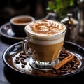 A cup of delicious aromatic cappuccino with thick milk foam, on a plate with coffee beans and cinnamon,