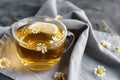 Cup of delicious camomile tea on table, closeup Royalty Free Stock Photo