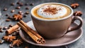 Cup of delicious cappuccino with cinnamon. Dried anise flower and coffee beans on table