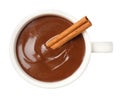 Cup of delicious hot chocolate with cinnamon stick isolated on white, top view Royalty Free Stock Photo