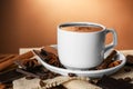 Cup of delicious hot chocolate, spices and coffee beans on table Royalty Free Stock Photo