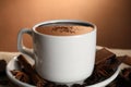 Cup of delicious hot chocolate, spices and coffee beans on table, closeup Royalty Free Stock Photo