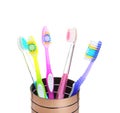 Cup with different toothbrushes