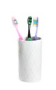 Cup with different toothbrushes