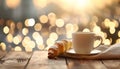 Cup of drink and pastry on table against blurred lights, space for text Royalty Free Stock Photo