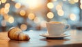 Cup of drink and pastry on table against blurred lights, space for text Royalty Free Stock Photo