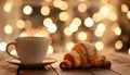 Cup of drink and pastry on table against blurred lights, space for text Royalty Free Stock Photo