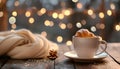 Cup of drink and pastry on table against blurred lights, space for text Royalty Free Stock Photo