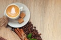 Cup with espresso with coffee beans, burlap sack and cinnamon on Royalty Free Stock Photo