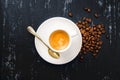 Cup of espresso coffee and beans on wooden black painted table Royalty Free Stock Photo
