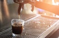 Cup of espresso with coffee machine. Brewing coffee Royalty Free Stock Photo