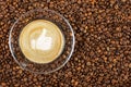 Cup of espresso with like sign on coffee foam on coffee beans background. With copy space Royalty Free Stock Photo