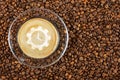 Cup of espresso with like sign on coffee foam on coffee beans background. With copy space Royalty Free Stock Photo