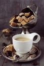 Cup of espresso, sugar cubes and chocolate candy on rustic wooden background Royalty Free Stock Photo