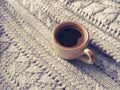 A Cup of espresso in a winter sweater. The concept of home comfort, coziness and warmth. Royalty Free Stock Photo