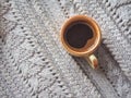 A Cup of espresso in a winter sweater. The concept of home comfort, coziness and warmth. Royalty Free Stock Photo