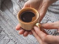 A Cup of espresso in a winter sweater. The concept of home comfort, coziness and warmth. Royalty Free Stock Photo
