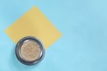 Cup of filter coffee with yellow note paper on blue background, top view Royalty Free Stock Photo