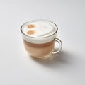 Hot cappuccino in a glass cup with a smile face on a gray background with space for text.