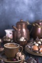 A cup of fragrant coffee and brown sugar. Vintage photo. Eggs chicken and quail and feathers. Easter. Photo in a rustic style.