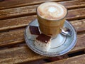 Cup of fresh cappuccino coffee latte served with coconut cake Royalty Free Stock Photo