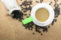 Cup of fresh coffee with coffee beans on burlap warm cup on brown background top view Royalty Free Stock Photo