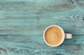 Cup of fresh coffee on vintage blue table