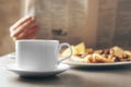Cup of fresh hot coffee and breakfast on table Royalty Free Stock Photo