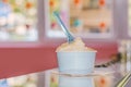 Cup of fruty ice cream pouring in shop Royalty Free Stock Photo