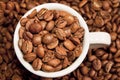 Cup full of coffee beans Royalty Free Stock Photo
