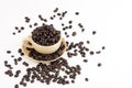 Cup full of coffee beans on on white background Royalty Free Stock Photo