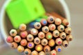 Cup full of colouring pencils and green pencil sharpener - stock photo.jpg Royalty Free Stock Photo