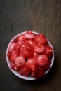 cup full of jambu or rose apple on table top