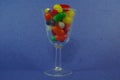 A cup full of Jelly beans candies with a blue background Royalty Free Stock Photo