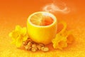 Cup of ginger root tea with lemon, honey and yellow and orange daffodil flowers Royalty Free Stock Photo