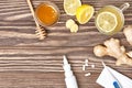 Cup of ginger tea, honey, lemon, pills, thermometer Royalty Free Stock Photo