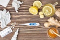 Cup of ginger tea, honey, lemon, pills, thermometer Royalty Free Stock Photo