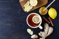 Cup of ginger tea with lemon and honey on dark background. Top view. Antiviral Healthy useful drink. Royalty Free Stock Photo