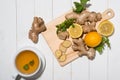 Cup of Ginger Tea with Lemon and Honey on a White Wooden Background. Royalty Free Stock Photo