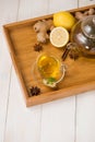 Cup of ginger tea with lemon and honey on white wooden background. Royalty Free Stock Photo